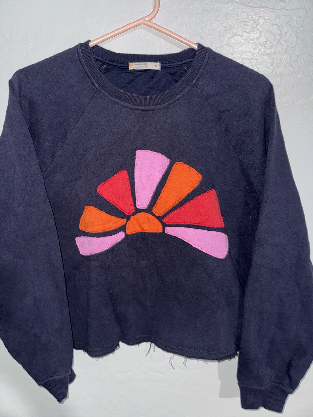Marine Layer Navy Pullover Sweatshirt with Pink, Orange & Red Sunburst